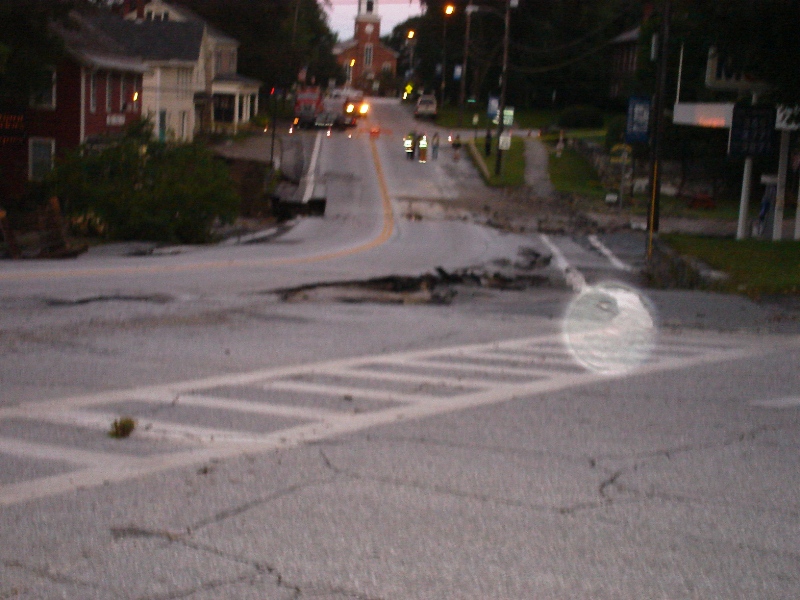 road wash out on the way into the Mobil station